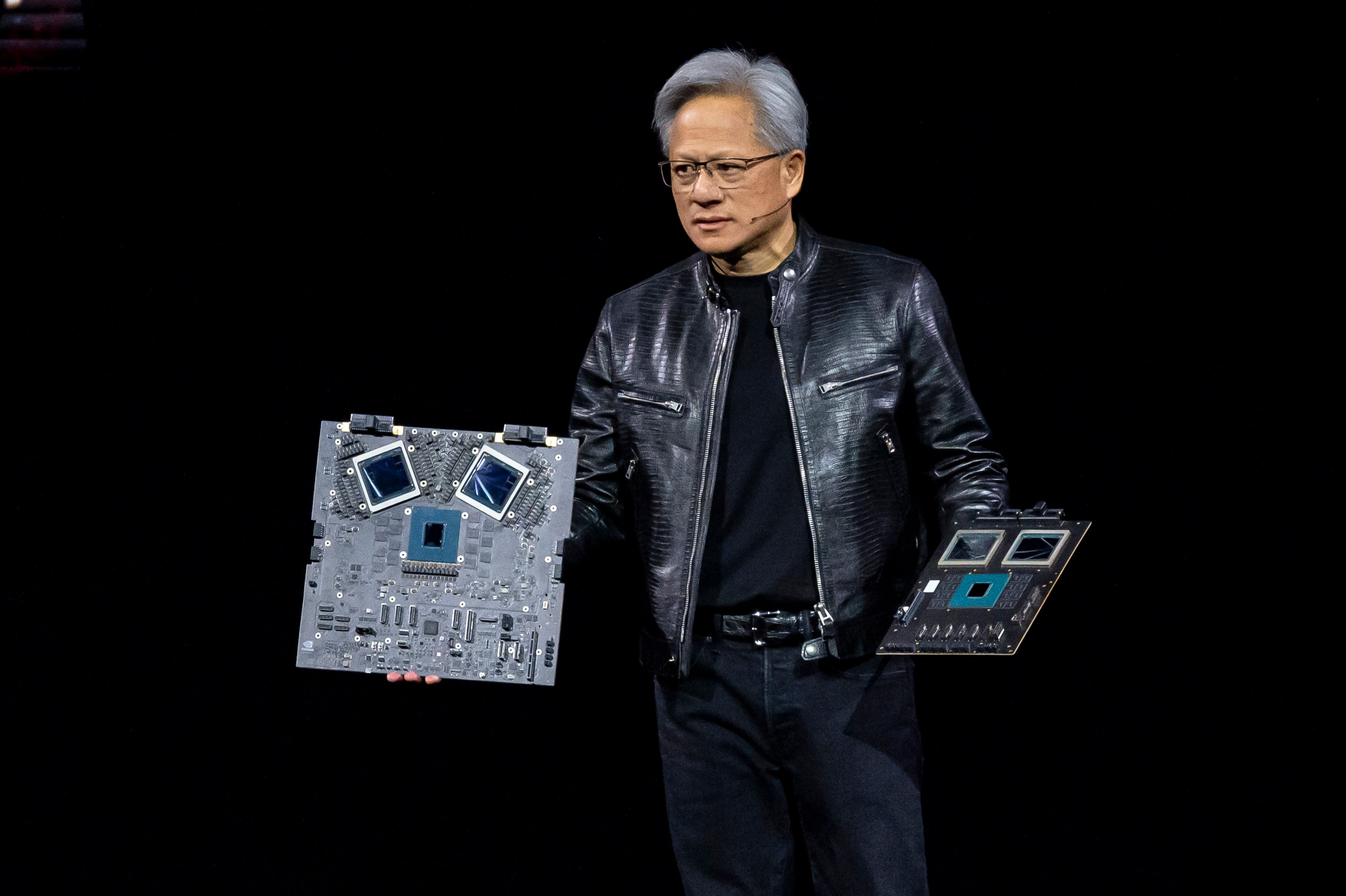 Jensen Huang, co-founder and CEO of Nvidia, displays the new Blackwell GPU chip during the Nvidia GPU Technology Conference in San Jose, California, on March 18, 2024.