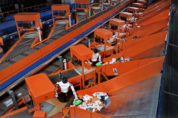 ROBOTERA M7 humanoid robot performing small parcel induction and sorting in a logistics environment