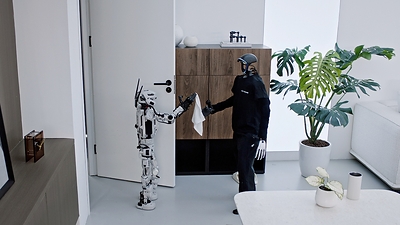 LightBot, Light Origins' in-house humanoid, performs a towel-handoff task in a real-world Light-O1 demonstration. Source: Light Origins LightBot, Light Origins' in-house humanoid, performs a towel-handoff task in a real-world Light-O1 demonstration. Source: Light Origins